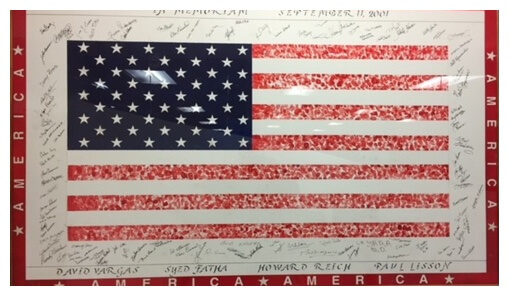 Image of an American flag with Pitney Bowes employees’ signatures