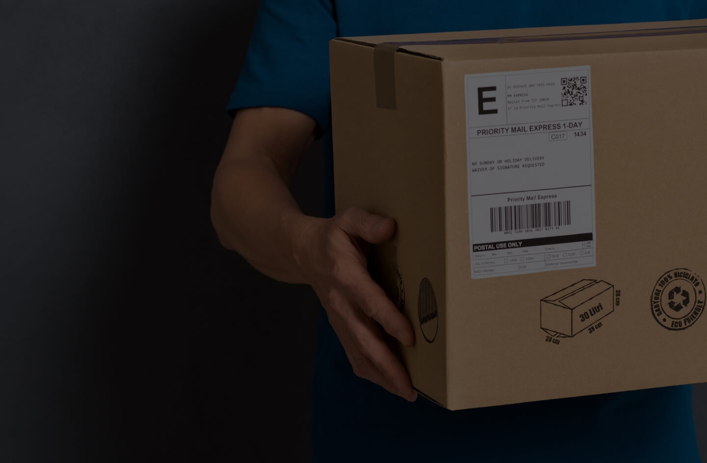 Image of man holding package with shipping label
