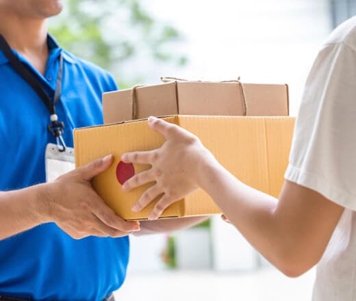 Image of person handing a package to someone