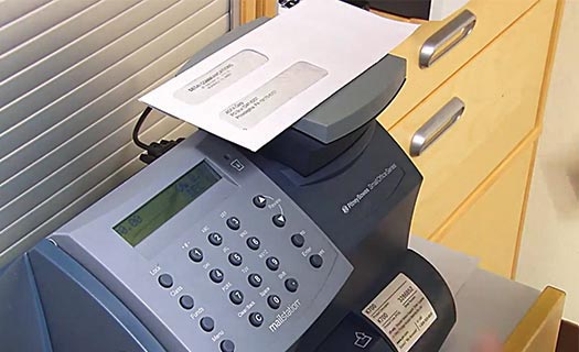 Using a Pitney Bowes postage meter, Desai Communications saves money, time and headaches.