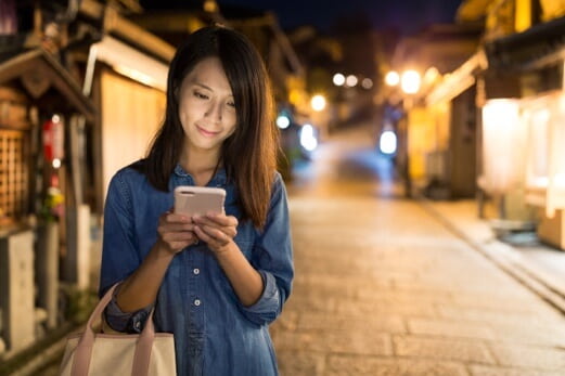 Image of Image of woman on cell phone