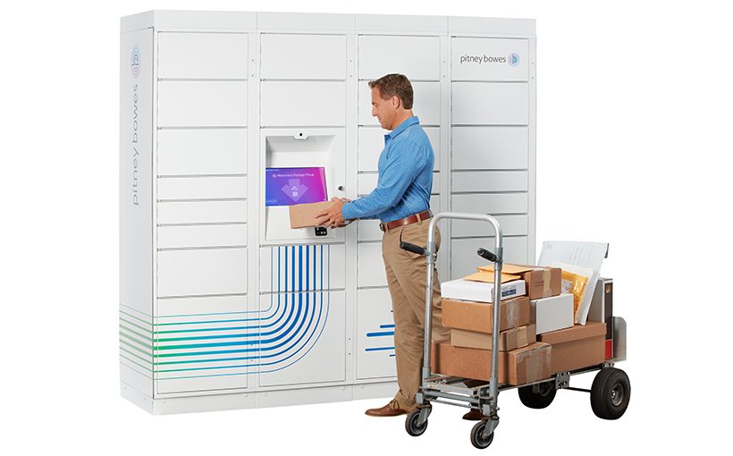 man scanning cart full of packages using Pitney's smart parcel locker