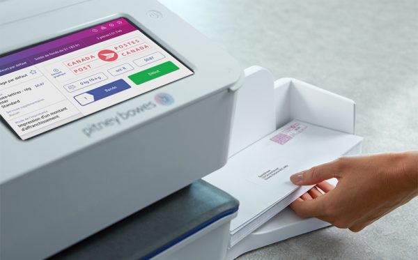 piece of mail going through the SendPro C Auto