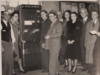Pitney Bowes people stading close to mailomat