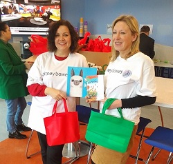 Pitney Bowes girls showing books