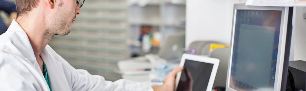 hospital technician working on a tablet hospital technician working on a tablet