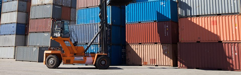 shipping containers being stacked