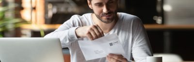 A man opening an envelope