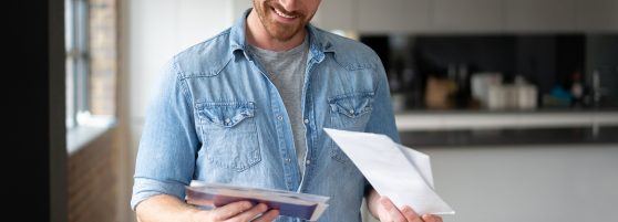 man holding an envelope