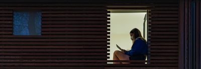 teenage girl wearing mask sitting in her window royalty