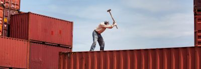 worker working on cargo container at commercial