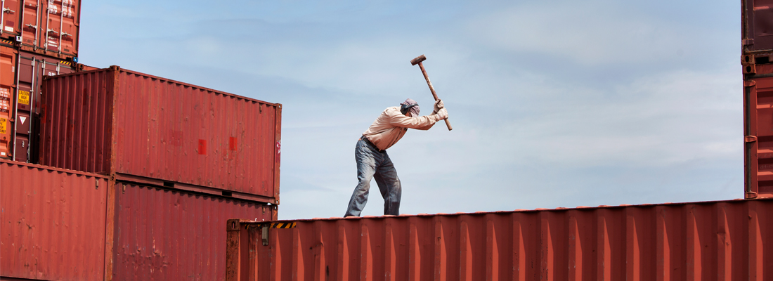 worker working on cargo container at commercial