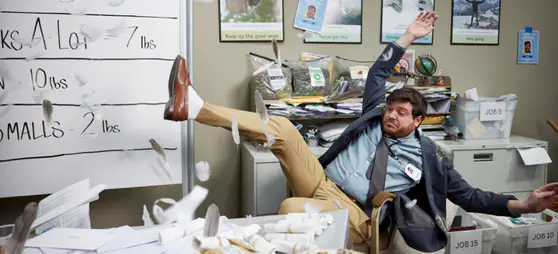 Chance falling off a chair surrounded by envelopes