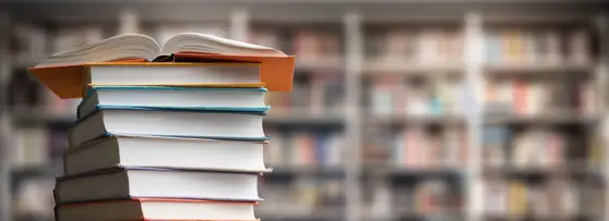 stack of books in a library