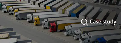 lots of shipping trucks in a parking lot