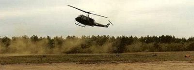 helicopter landing in a field