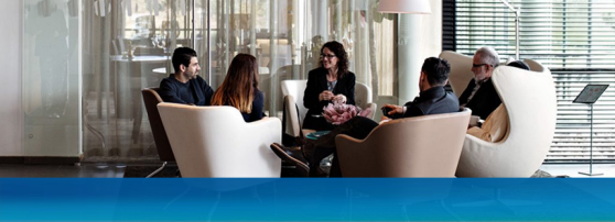 people in a circle sitting in office chairs