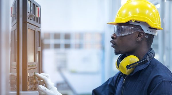 man wearing a construction hat and protective eyewear