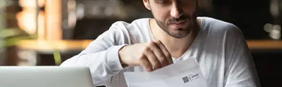 man opening a letter