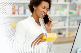 Pharmacist on a phone in a pharmacy