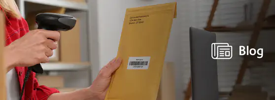mailroom clerk scanning a barcode on a manila envelope