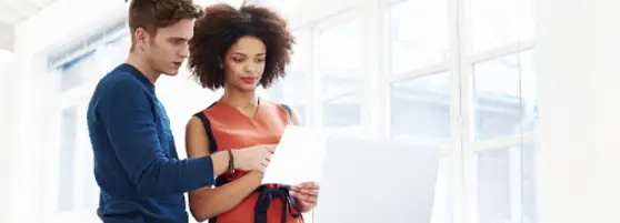 Man and woman looking at a document