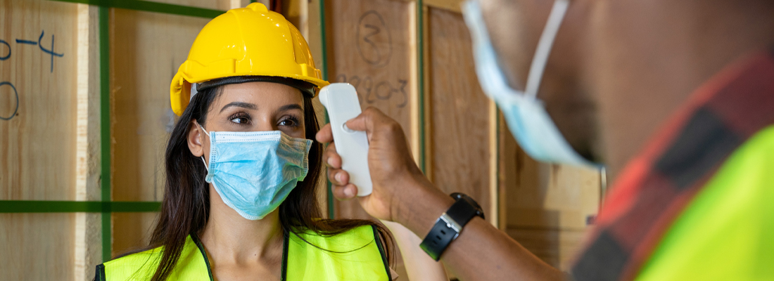 Employee checking temperature 