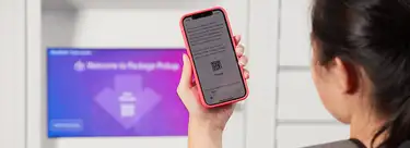 student using mobile phone to access a parcel locker
