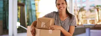 college student carrying multiple packages