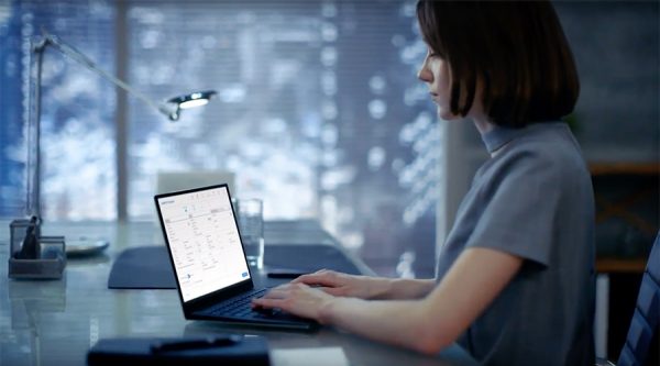 Young lady typing on a laptop