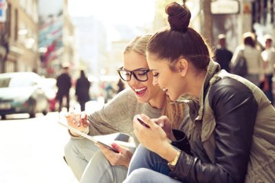 Two women laughing together