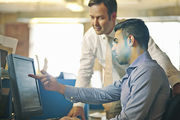 2 People looking at a monitor