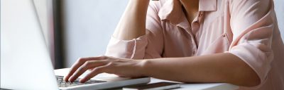 Young lady looking at the desktop screen