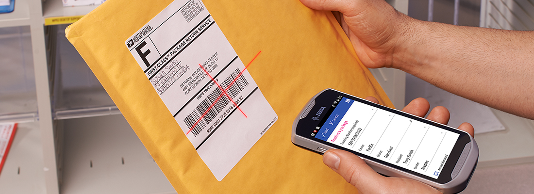 Man scanning an envelope using a cell phone