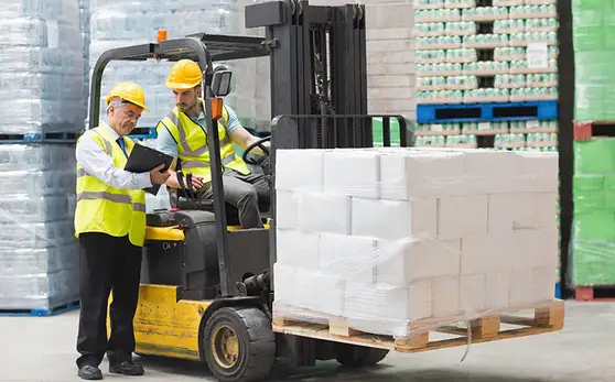 2 persons working at a shipping factory
