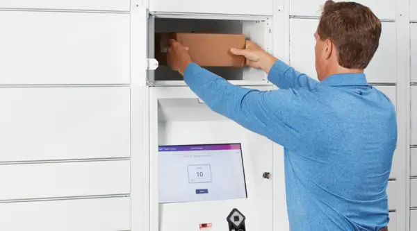 Man putting package in locker