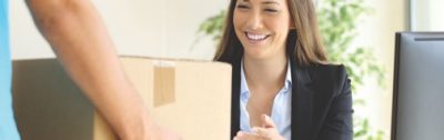 woman receiving package in office