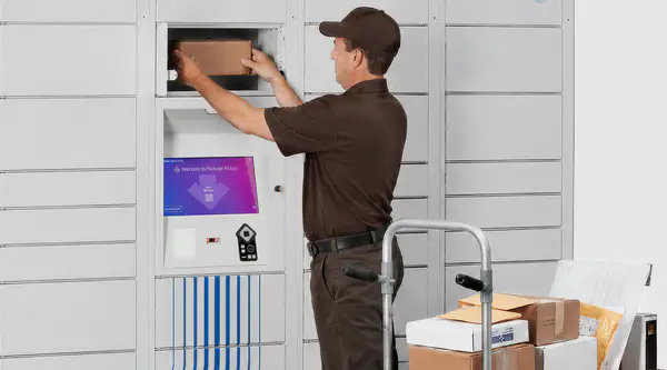 A package carrier placing a shipping box in the smart locker