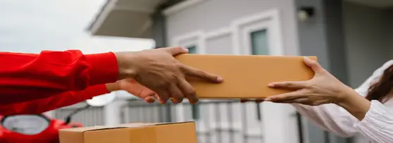 Person handling parcel to a woman