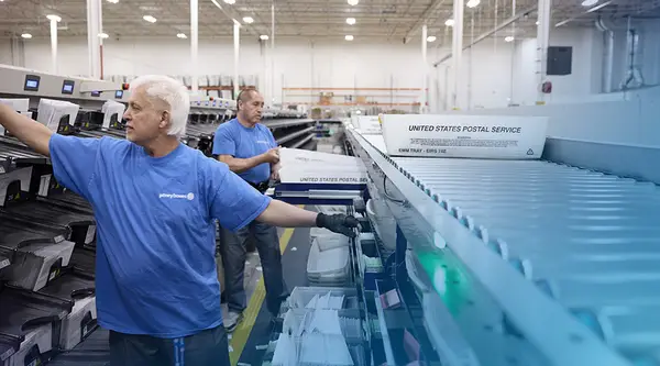 Pitney Bowes employees in working in a Presort facility